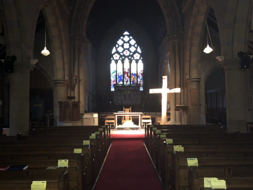 St johns in Darkness, the cross is lit.